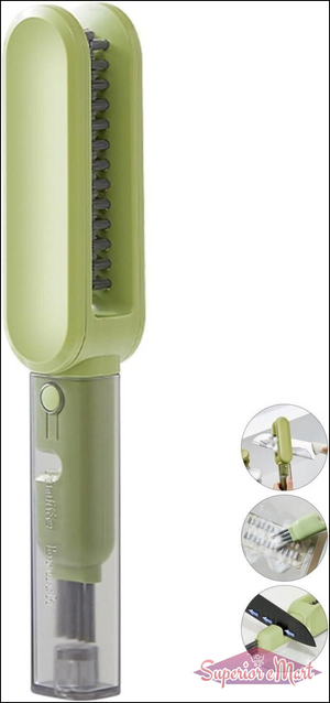 Green handheld cleaning brush with bristle head and visible brand name on a white background.