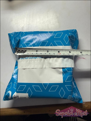 Blue 6-inch poly mailer with white pattern and tamper-evident seal: 'do not accept this parcel if it is tampered'.