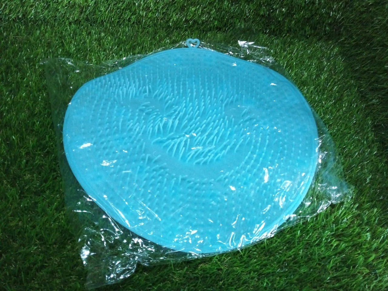 Shower foot brush mat with dual functionality for cleaning and massage.