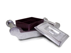 Decorative silver storage box with four sections for organizing.