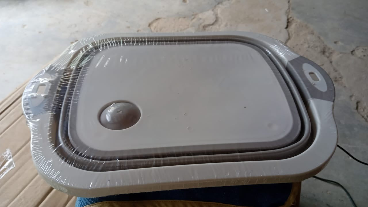 Collapsible cutting board with a dish tub basket