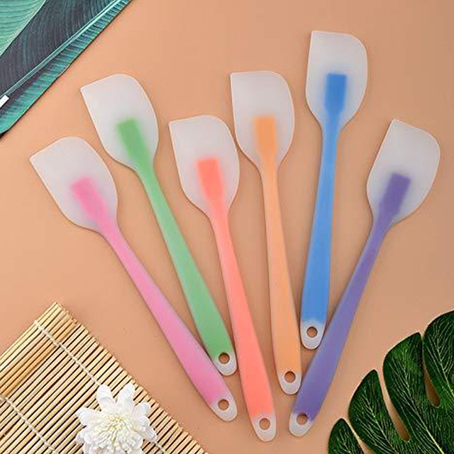 Multicolor silicone spatula for cooking, emphasizing its ergonomic handle and non-stick properties