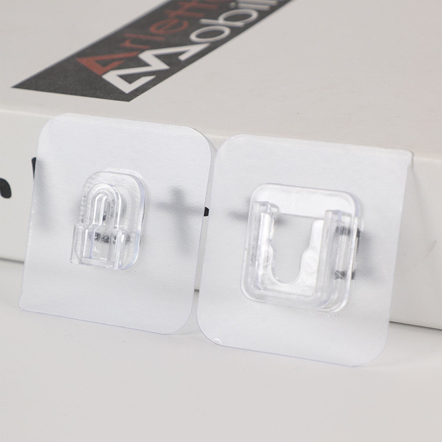 Clear heavy duty adhesive hooks for secure wall mounting and organization of items