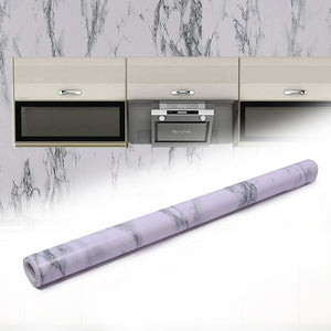 Superior eMart adhesive kitchen wallpaper with white marble pattern applied behind beige kitchen cabinets and appliances