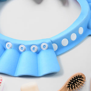 Adjustable baby shower cap in blue color designed to keep water away from baby's face during bath time