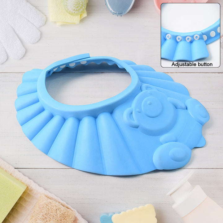 Blue adjustable baby shower cap with bear design and adjustable button for easy use during bath time