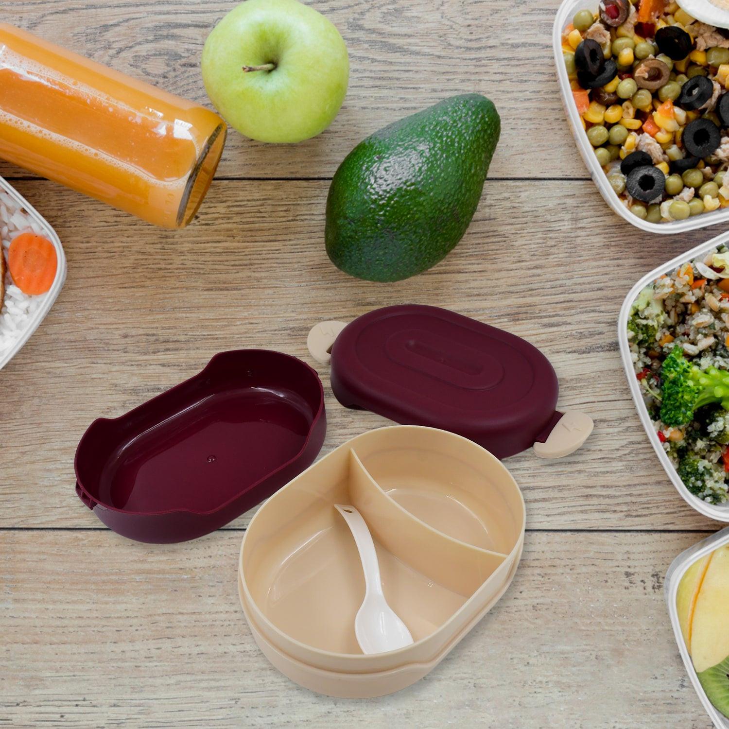 Set of airtight food grade tiffin boxes in two colors with a spoon and healthy meal options