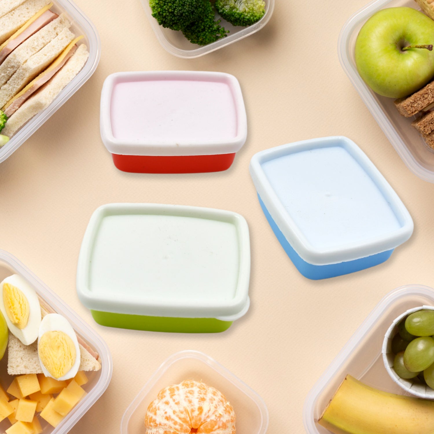 Airtight food storage containers set in various colors with healthy meal prep ingredients like fruits and vegetables