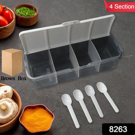 Airtight kitchen storage container with four sections and measuring spoons for organized food storage
