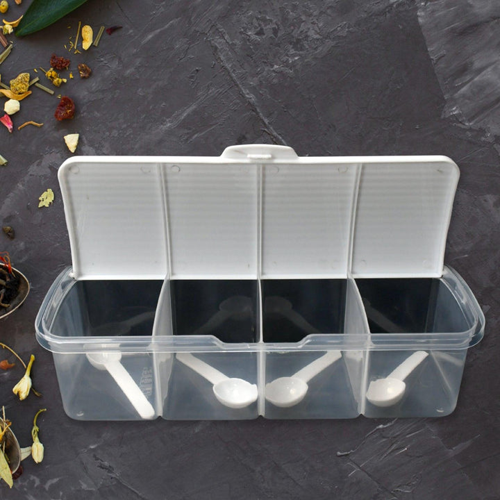 Airtight kitchen storage container with three compartments and measuring spoons for organized pantry use