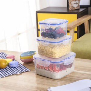 Airtight storage container set stacked with fruits and cereal on a wooden table
