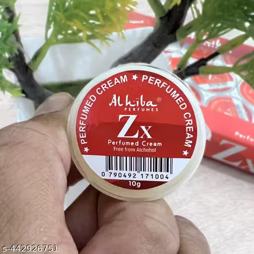 Al Hiba ZX perfumed body cream in a small container with red label, perfect for moisturizing and fragrance