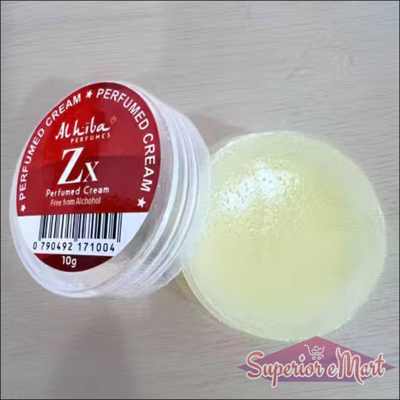 Perfumed cream container with a red label on a light wooden surface