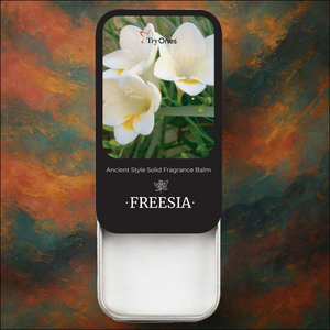 Ancient style solid perfume in a sleek tin featuring freesia flower scent for a timeless fragrance experience