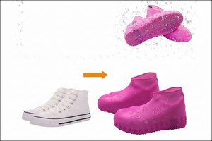 Waterproof pink silicone shoe covers with textured non-slip soles, shown protecting white sneakers from water splashes.