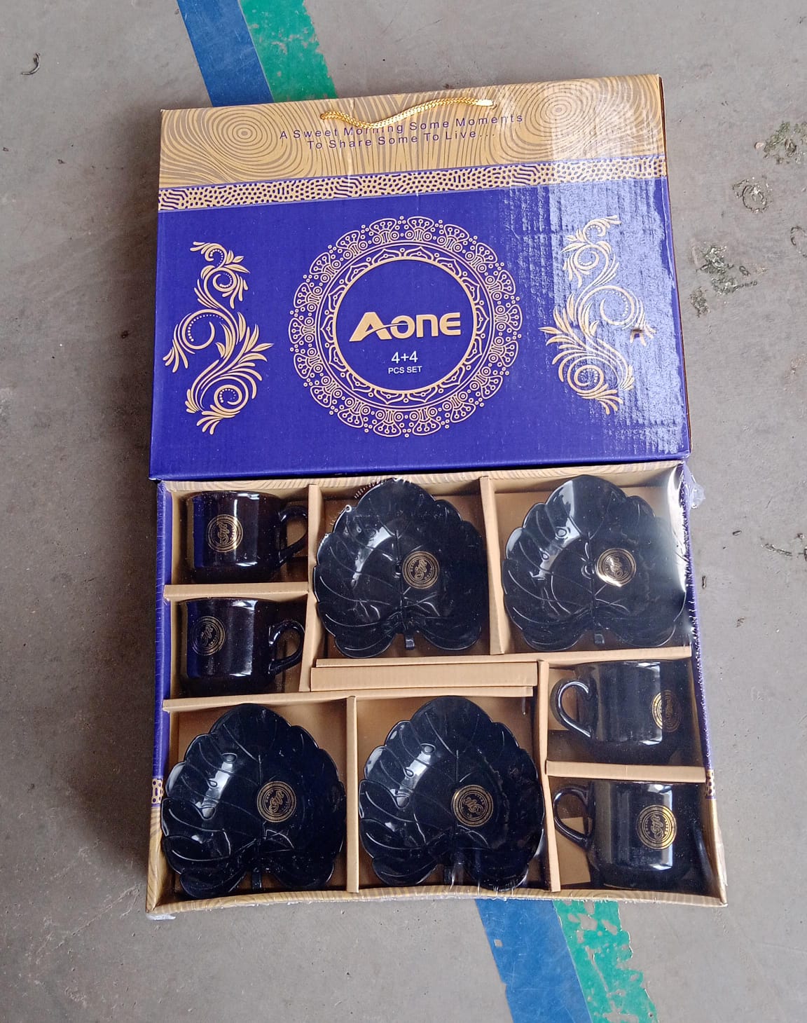 Ceramic tea cup and bowl set in elegant black finish, perfect for stylish dining and tea service