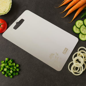 Superior eMart stainless steel chopping board on a kitchen counter with fresh vegetables