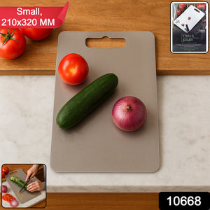 Superior eMart stainless steel chopping board with a cucumber, tomato, and onion on a kitchen countertop