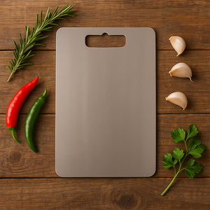 Superior eMart stainless steel chopping board with herbs and garlic on a wooden surface