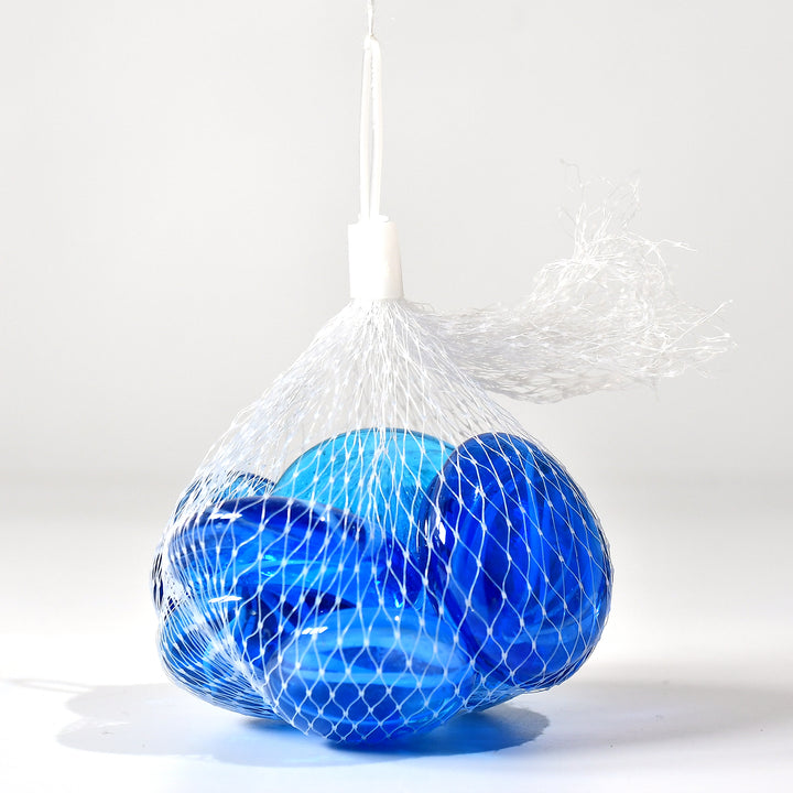 Blue aquarium glass marbles in a net bag for aquatic decorations and crafts