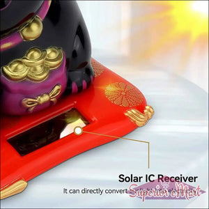 Wealth attracting cat figurine with solar IC receiver for charging from sunlight