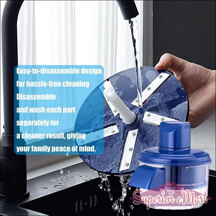 Blue food chopper being rinsed under a faucet. Features easy-to-disassemble metal blades and clear plastic bowl.