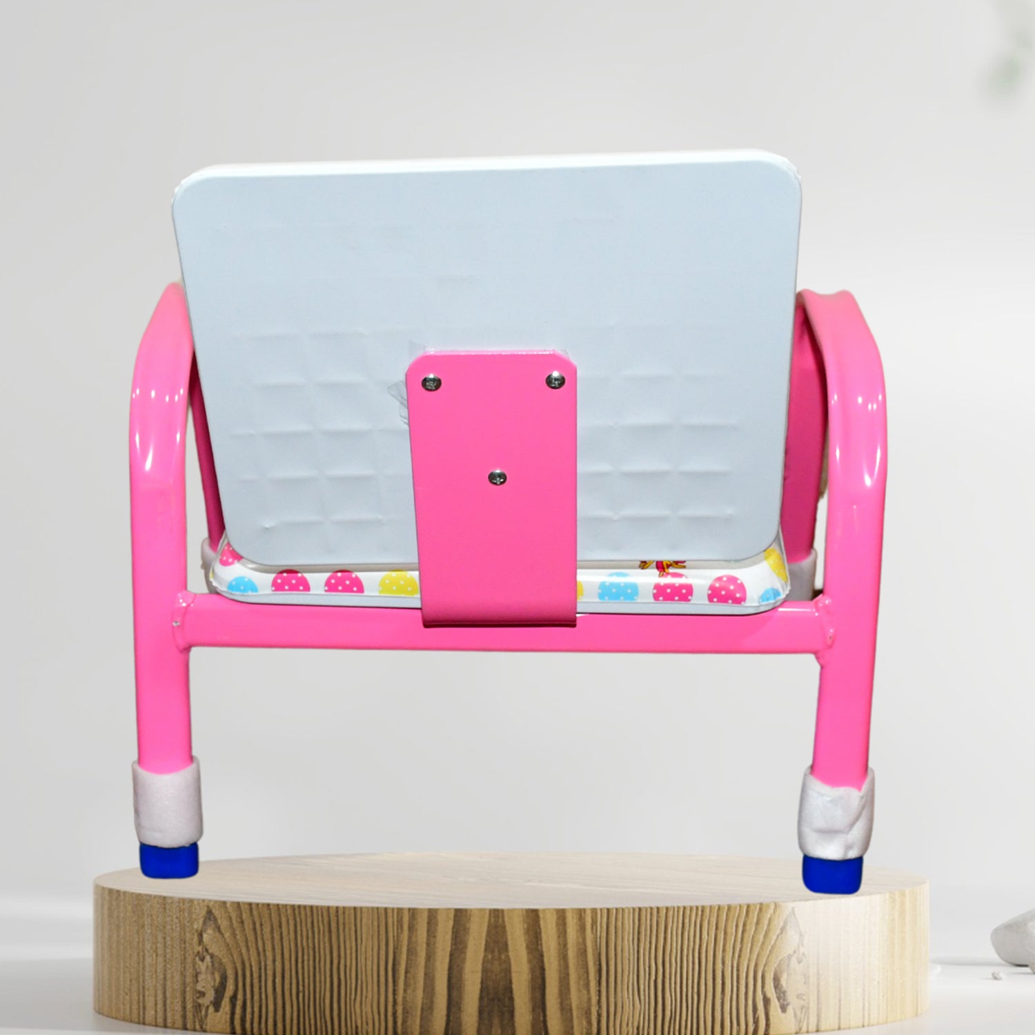 Pink baby chair with cushion on a wooden base, ideal for comfortable seating for infants