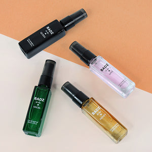 BADZ mini perfume spray set featuring four unique scents in stylish travel bottles