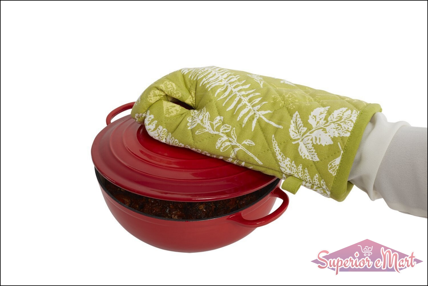 Heat proof oven glove in green with floral pattern, safely handling a red cooking pot