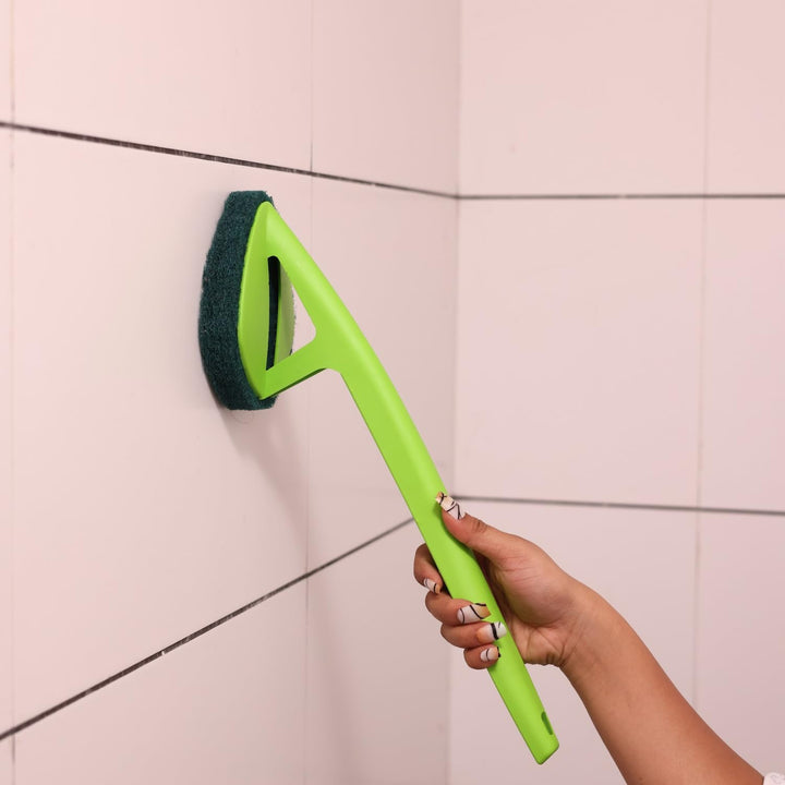 Ergonomic bathroom cleaning brush with a green handle for effective tile cleaning