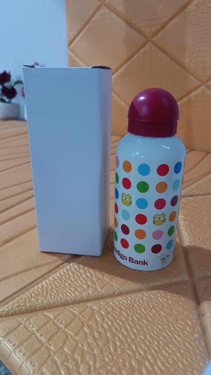 Aluminium Metal Sports Water Bottle 1 Pc 350 ml with colorful polka dots and red lid next to box