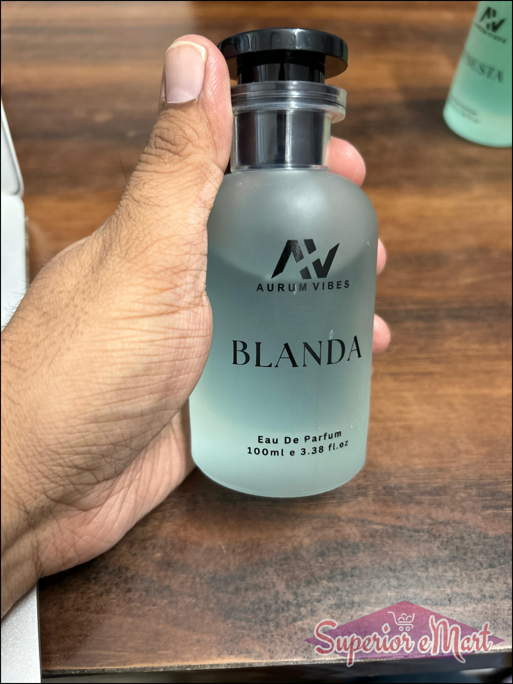 Blanda men's perfume 100ml in an elegant bottle held in hand, featuring a clean and modern design