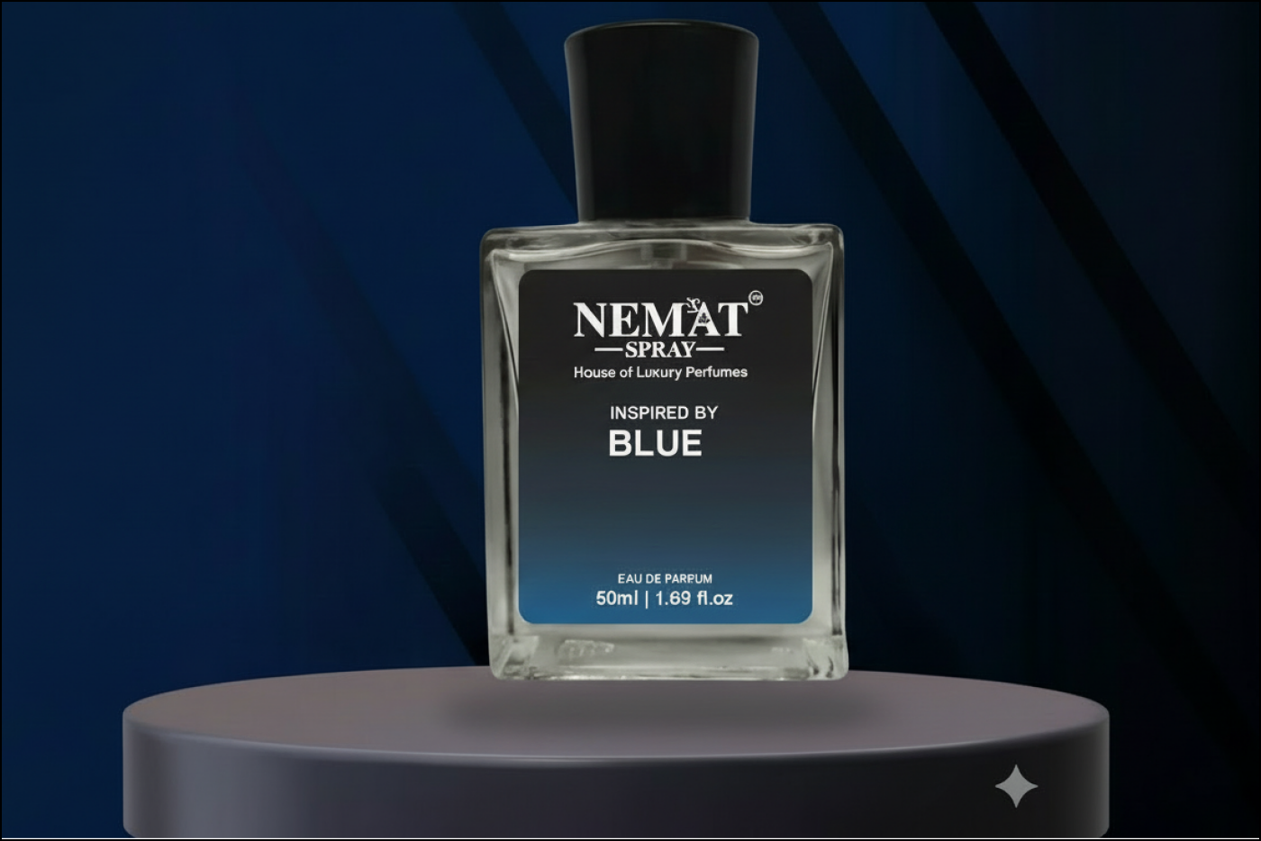Nemat Spray Inspired by Blue 50ml perfume bottle, clear glass with black cap, floating above a grey pedestal.
