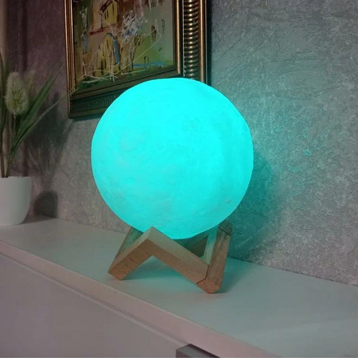 Blue moon night lamp with soft glowing light and wooden stand for cozy home decor