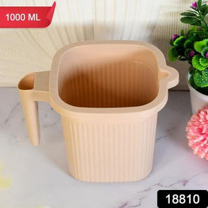 BPA free bath mug in beige with ribbed design and handle for easy gripping, perfect for daily use
