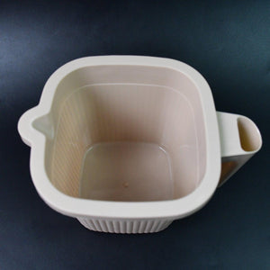 BPA free bath mug in beige with a handle for easy pouring and stylish use in the bathroom