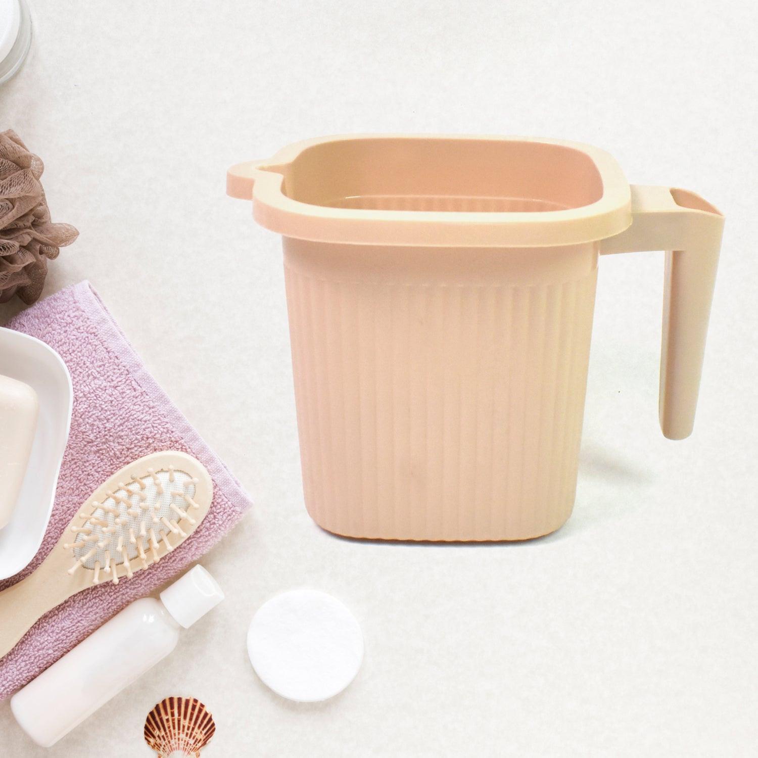 BPA free bath mug in soft beige color with a comfortable handle for easy use
