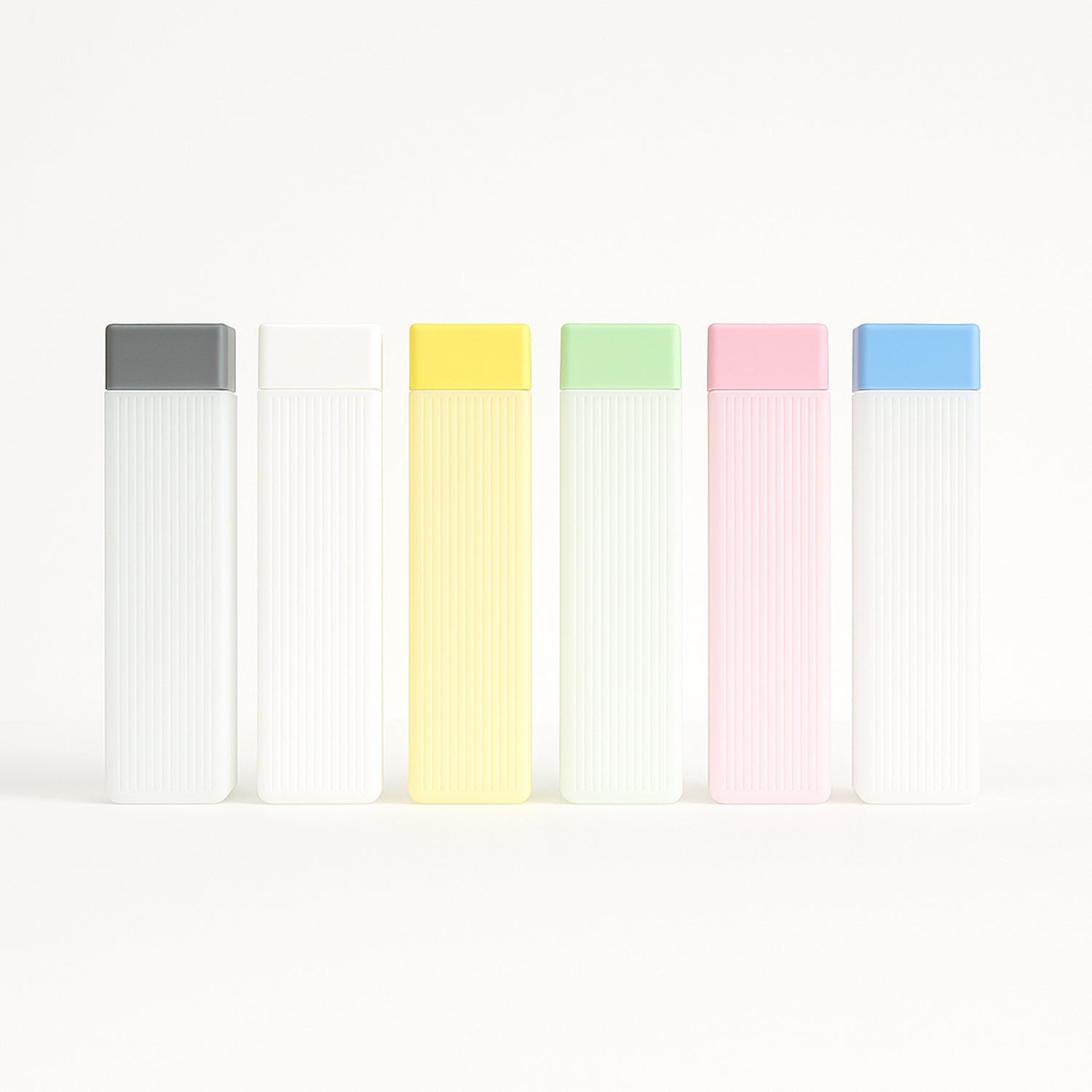 Set of BPA-free hydration water bottles with colorful caps in gray white yellow green pink and blue