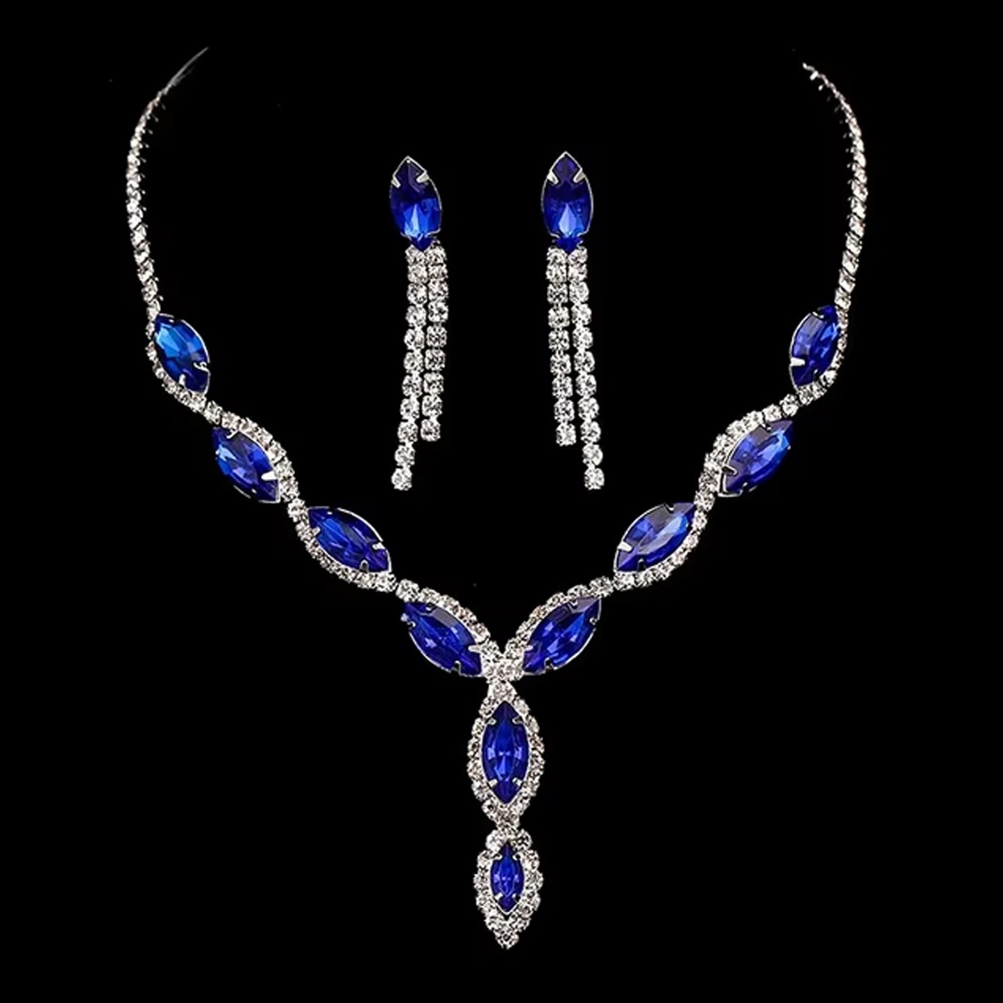 Elegant bridal necklace and earrings set featuring stunning blue gemstones and sparkling rhinestones
