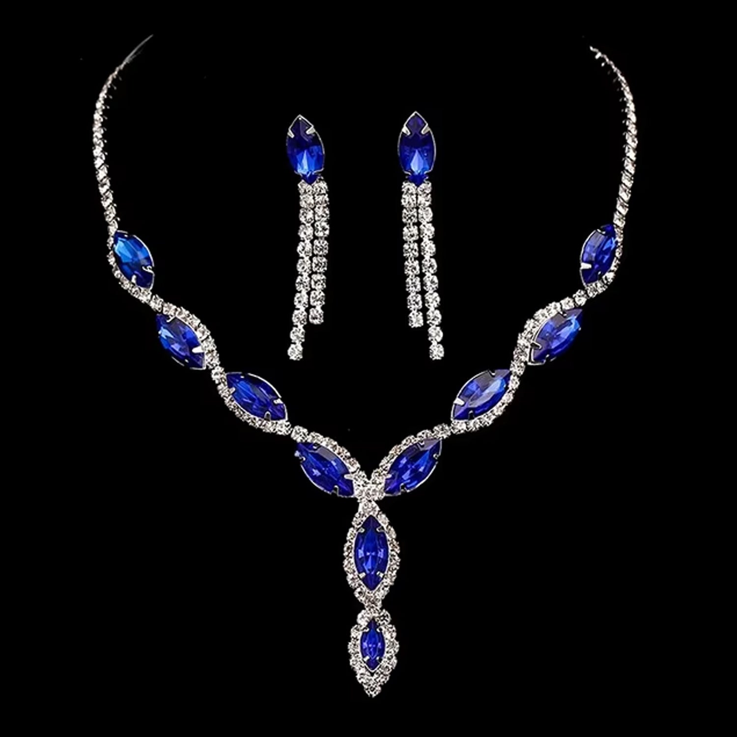 Elegant bridal necklace and earrings set featuring stunning blue gemstones and sparkling rhinestones