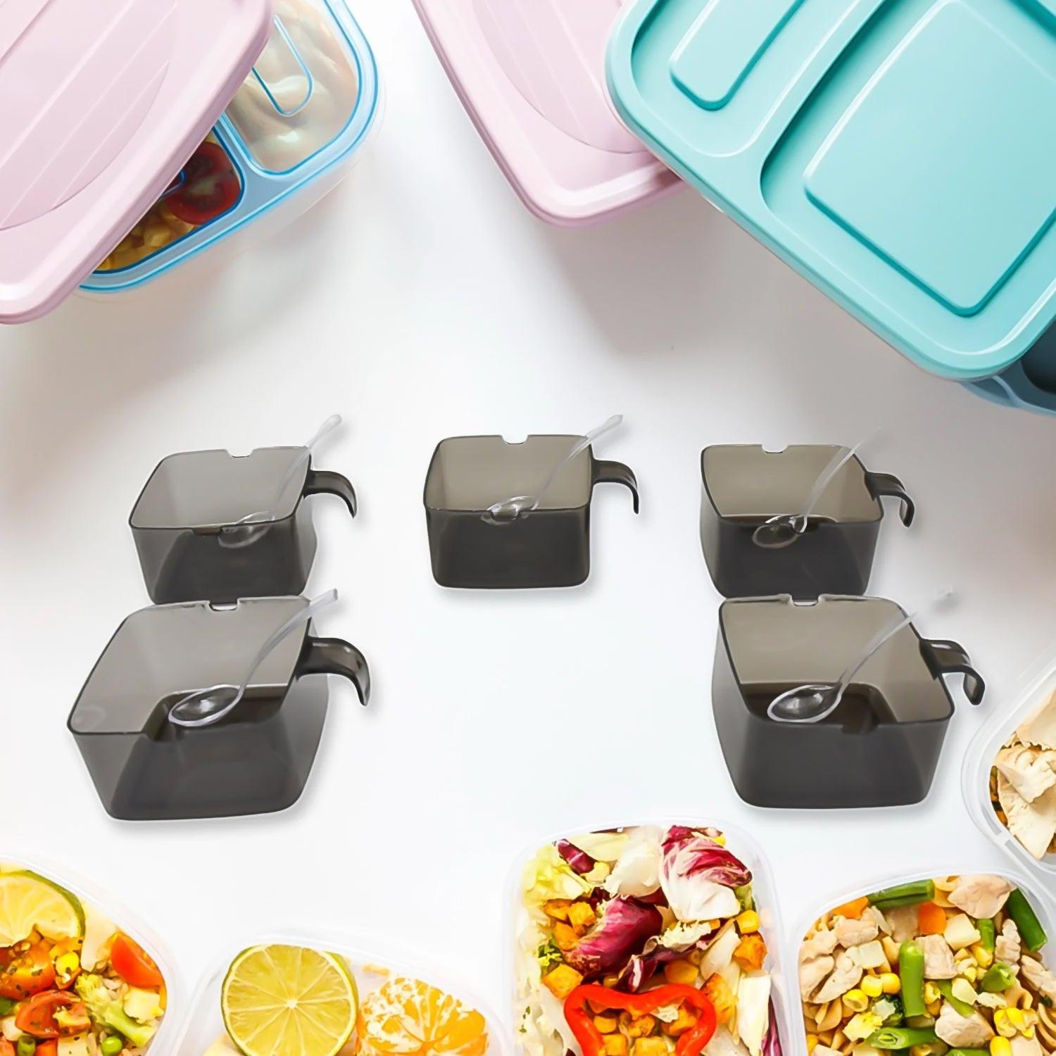 Rotating spice jars set with clear lids for organized kitchen storage and easy access