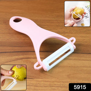 Ergonomic pink vegetable peeler with a stainless steel blade for easy peeling of fruits and vegetables