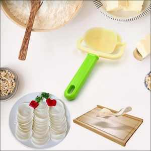 Green cake ball cutter with ergonomic handle for easy baking and food preparation