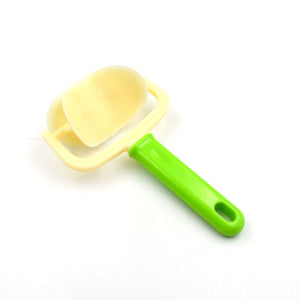 Superior eMart cake ball cutter with a green handle for easy ball shaping in baking