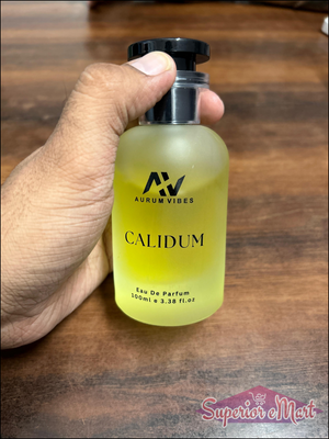 Calidum male perfume 100ml in a glass bottle held in hand, featuring a stylish design