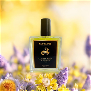 Capricorn Zodiac Unisex Perfume 50ml in a stylish bottle against a floral background