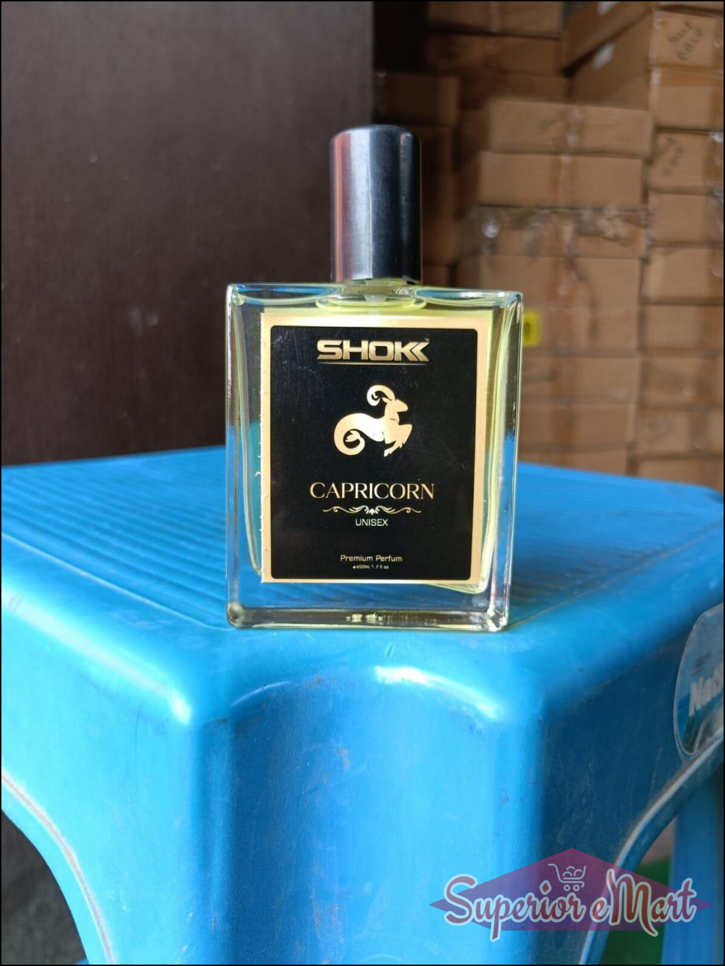 Capricorn Zodiac Unisex Perfume 50ml in a stylish bottle on a blue surface