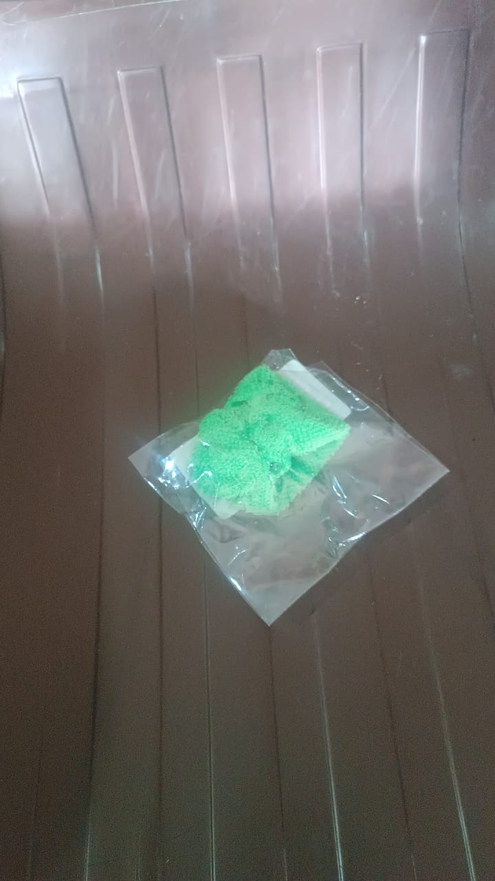 Superior eMart car windshield glass cleaner in a green packaging on a plastic surface