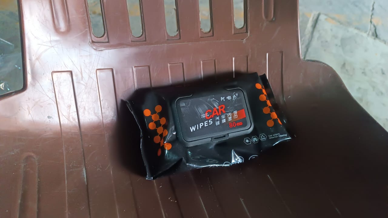 Superior eMart dashboard cleaning tissues in a black pack placed on a car interior surface