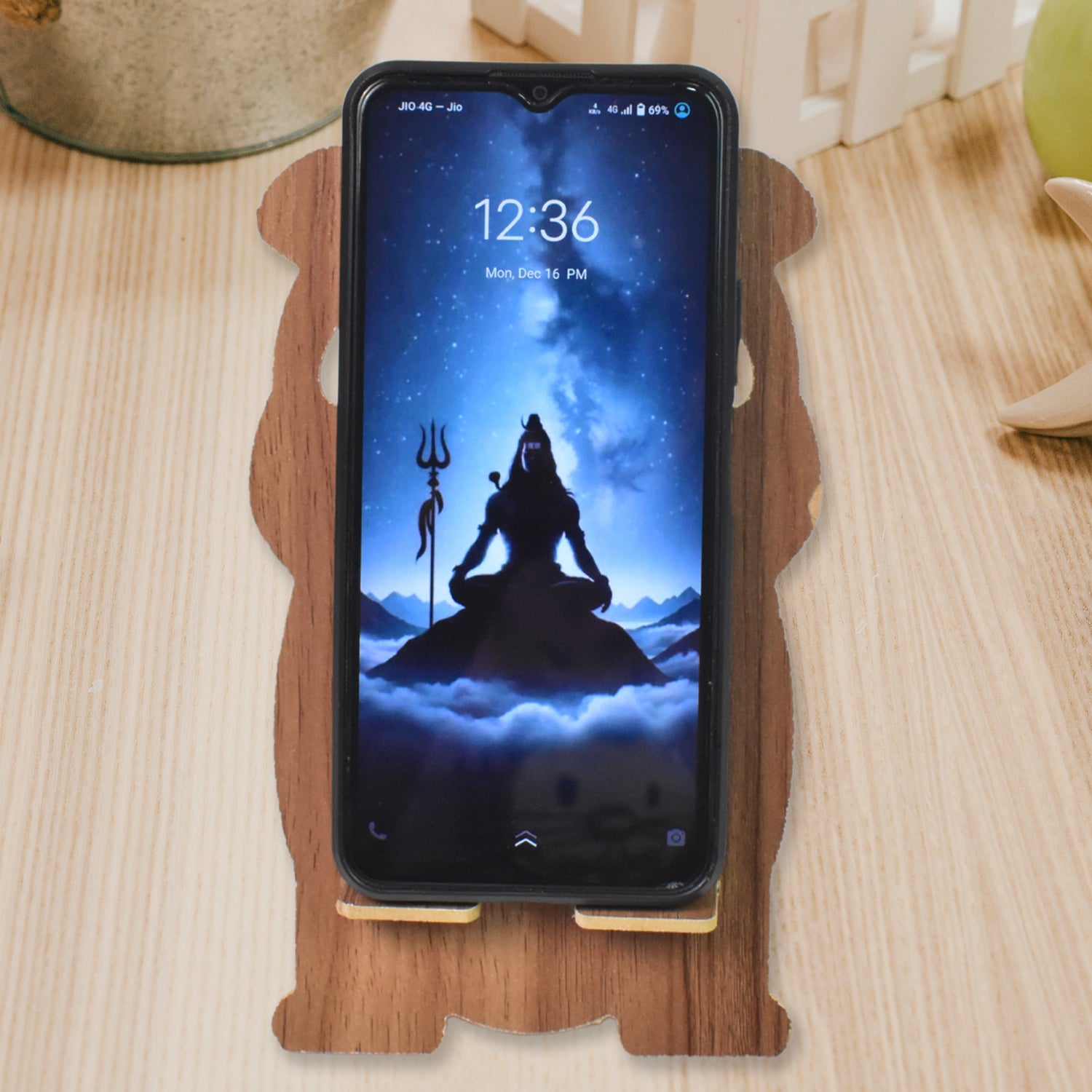 Cartoon wooden mobile stand featuring a fun design, perfect for holding smartphones securely